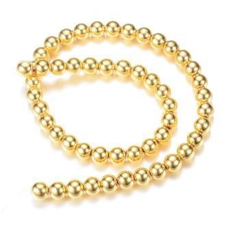 Kaufen Sie Perlen in der Schweiz Synthetische goldene runde Hämatitperle 4 mm – Loch: 1 mm (1 Strang – 39 cm)