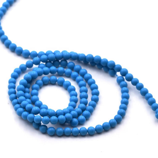 Kaufen Sie Perlen in der Schweiz Synthetische türkisfarbene runde Perle 2–2,5 cm – Loch 0,8 mm (1 Strang – 39 cm)