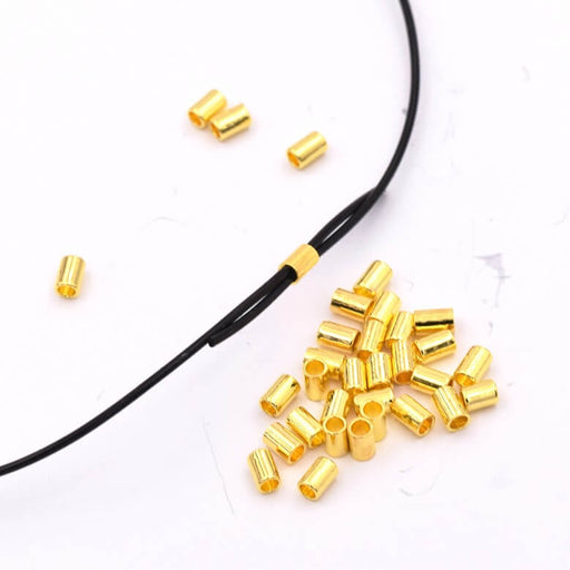 Kaufen Sie Perlen in der Schweiz Quetschperlen Gold Metallrohr für elastische Schnur 0.8 mm - 80 Stück (1)