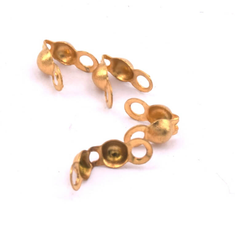 Suspension vintage en nacre et laiton doré motifs nœuds rose orangé