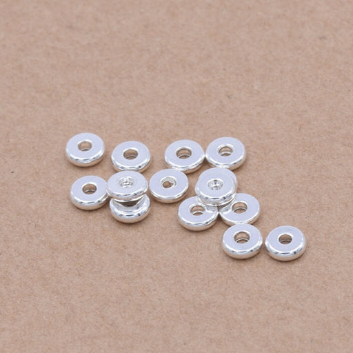 Achat Perles heishi séparateur en acier inoxydable argenté 4x1.2mm - Trou: 1.2mm (10)