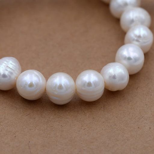 Kaufen Sie Perlen in der Schweiz Weiße Popatoe-Süßwasserperle 9–10 mm (1 Strang – 39,5 cm)