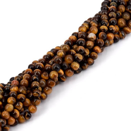 Kaufen Sie Perlen in der Schweiz Runde Tigerauge-Perle 5 mm – Loch 0.6 mm – 73 Perlen (1 Strang – 33 cm)