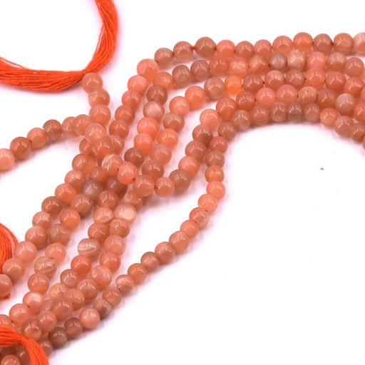 Kaufen Sie Perlen in der Schweiz Pfirsichfarbene Mondstein-Perle. rund 3.5 mm – Loch 0.6 mm (1 Strang – 33 cm)
