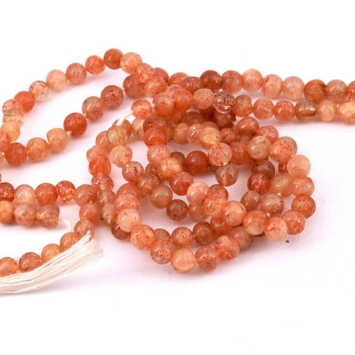Kaufen Sie Perlen in der Schweiz Runde Perle Sonnenstein 4 mm – Loch 0,6 mm (1 Strang – 33 cm)