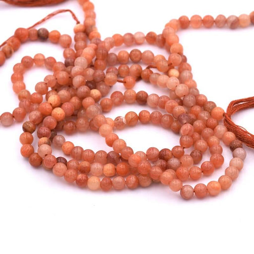Kaufen Sie Perlen in der Schweiz Runde Perle Orange Achat 3,5–4,5 mm – Loch 0,6 mm (1 Strang – 33 cm)