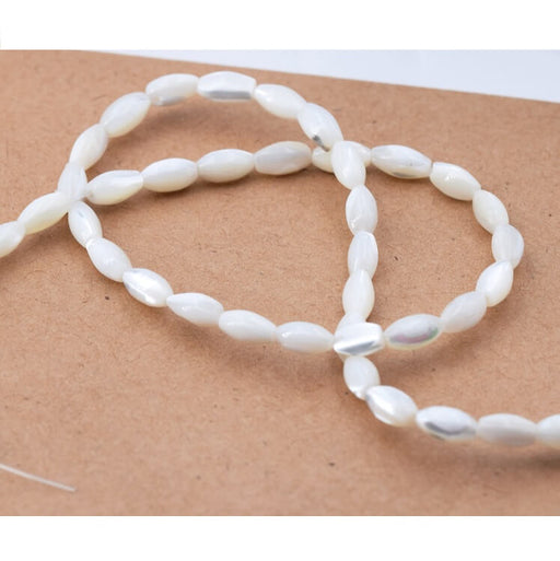 Achat Perles Forme Grain de Riz en Nacre Coquillage Blanc Naturel 6-7x4-5mm (1fil-38cm)