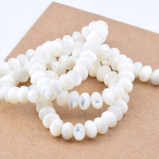 Kaufen Sie Perlen in der Schweiz Rondelle Perlen Donut Weiße Muschel - 6x4 mm (1 Strang - 40 cm)
