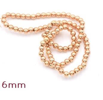 Perles d'hématite reconstituée doré or clair qualité 6mm - 1 rang - 64 perles (vendue par 1 rang)